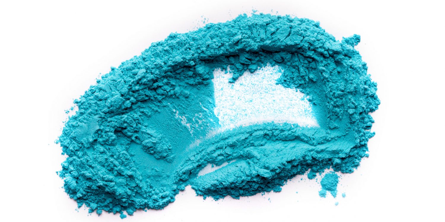 Happy holi. Blue powder for Spring festival on white background, copy space